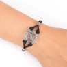 Pulsera Néfele Botón Charro de plata de primera de ley con marcasitas. Cuero negro. Motivo: 2,5cm. Foto en muñeca.