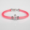 Pulsera cordón de cabo rosa con cierre mosquetón. Con Charm de Virgencita de Covadonga en plata de ley.
