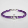 Pulsera cordón de cabo morado con cierre mosquetón. Con Charm de Virgencita de la Almudena en plata de ley. Muestra principal.
