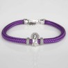 Pulsera de cordón de cabo morado con cierre mosquetón. Con charm de Virgencita del Pilar en plata de ley. Muestra principal.