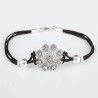 Pulsera cordón seda negra Botón Charro de plata de primera de ley con marcasitas. Motivo: 1,7cm. Largo: 18,5cm.