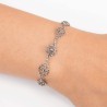 Pulsera de plata de primera ley con Botón charro y adornos de floritura, montadas con marcasitas. Foto muestra en muñeca.