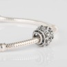 Charm Boton Charro de filigrana en plata de ley para la pulsera de Pandora o similares. Muestra en detalle pulsera Pandora.